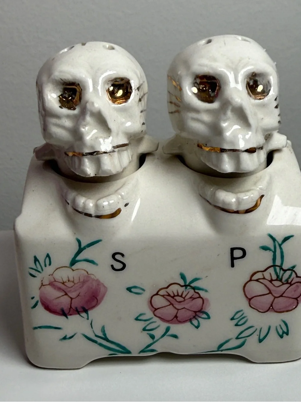 Vintage nodding skull Salt and Pepper Set w floral accents Halloween MOVES!